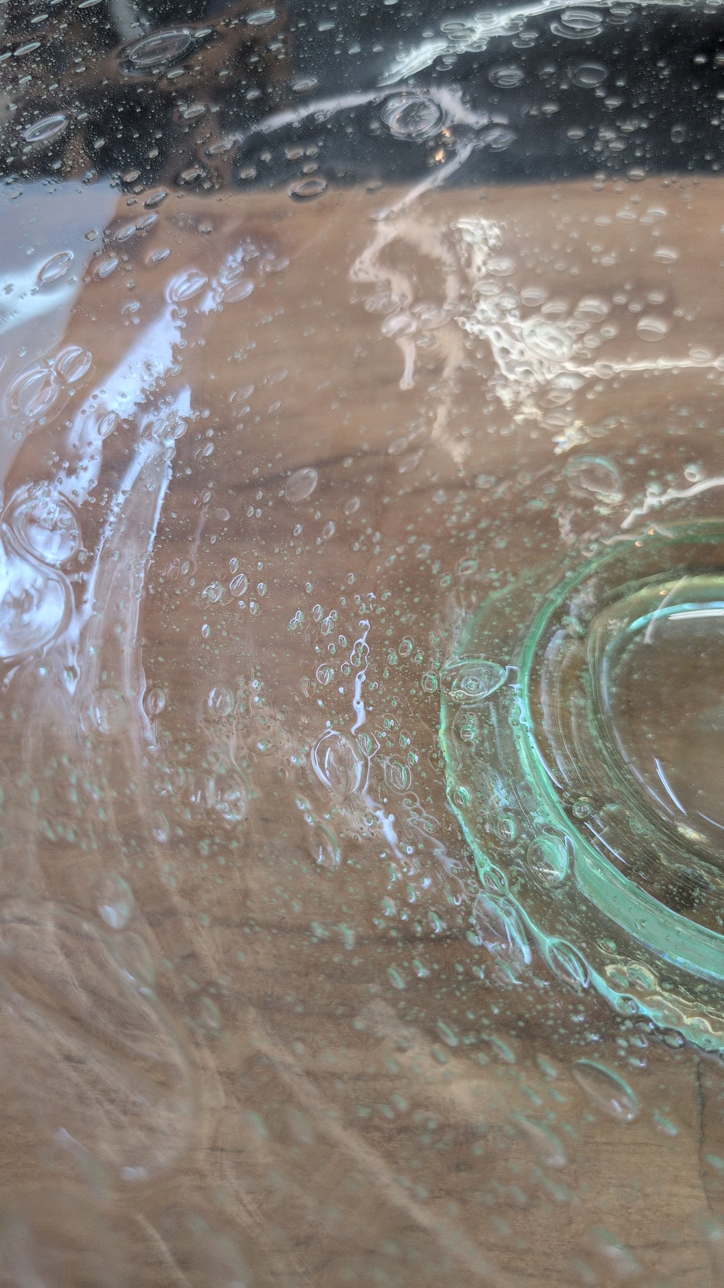 Hand-blown green Blenko glass bowl with trapped air bubbles