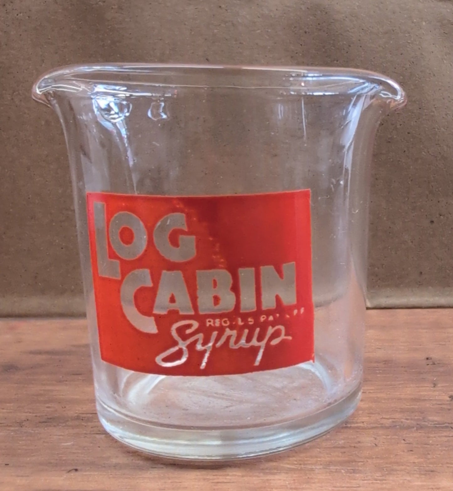 Vintage log cabin Syrup Mini measuring cup.